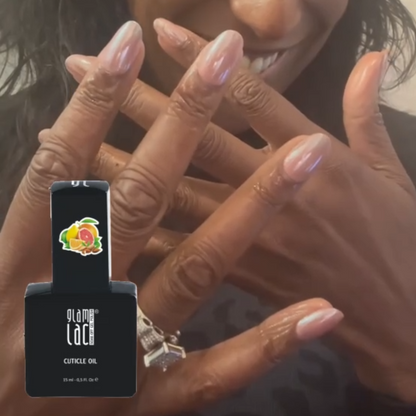 Applying citrus cuticle oil to a set of press on nails